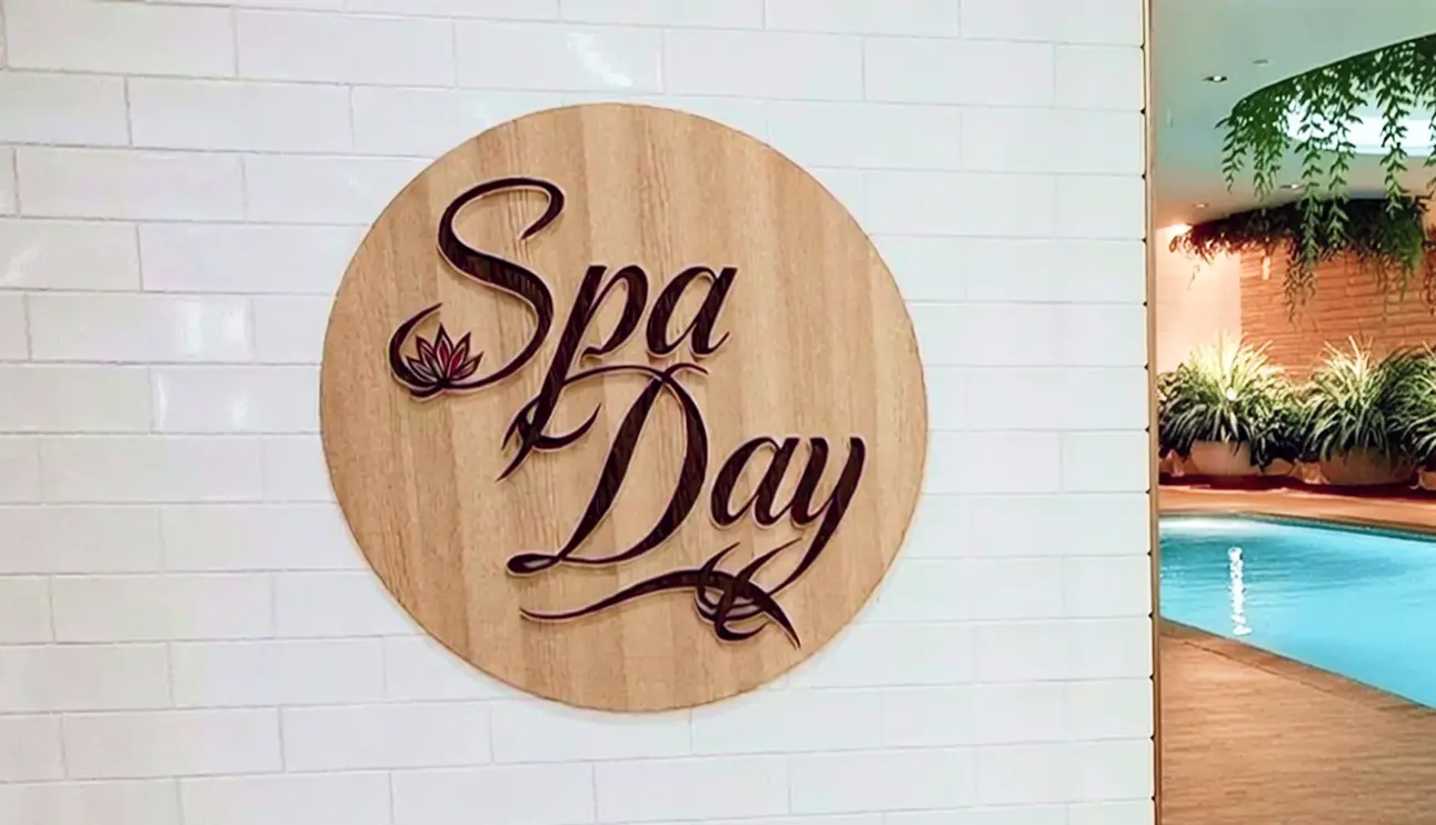 'Spa Day' wooden letter sign installed on a salon wall