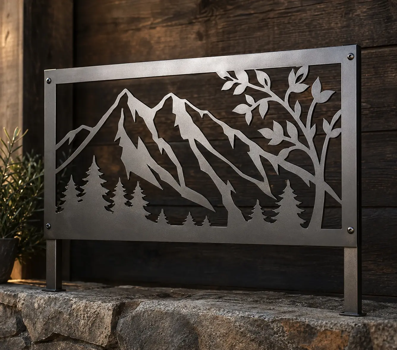 Laser-cut metal panel sign with mountain and tree artwork in negative space