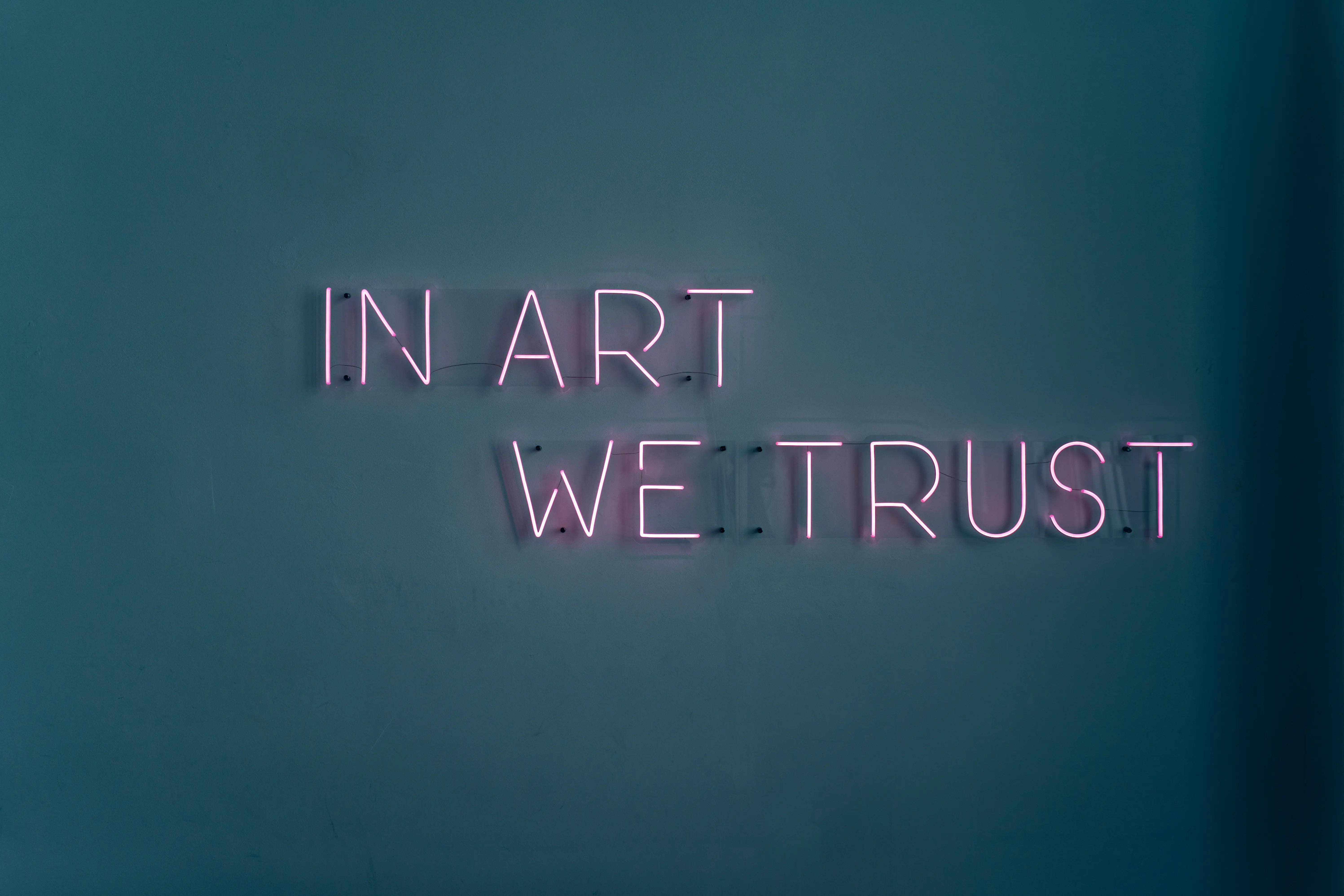 Custom neon sign installed on a textured interior wall