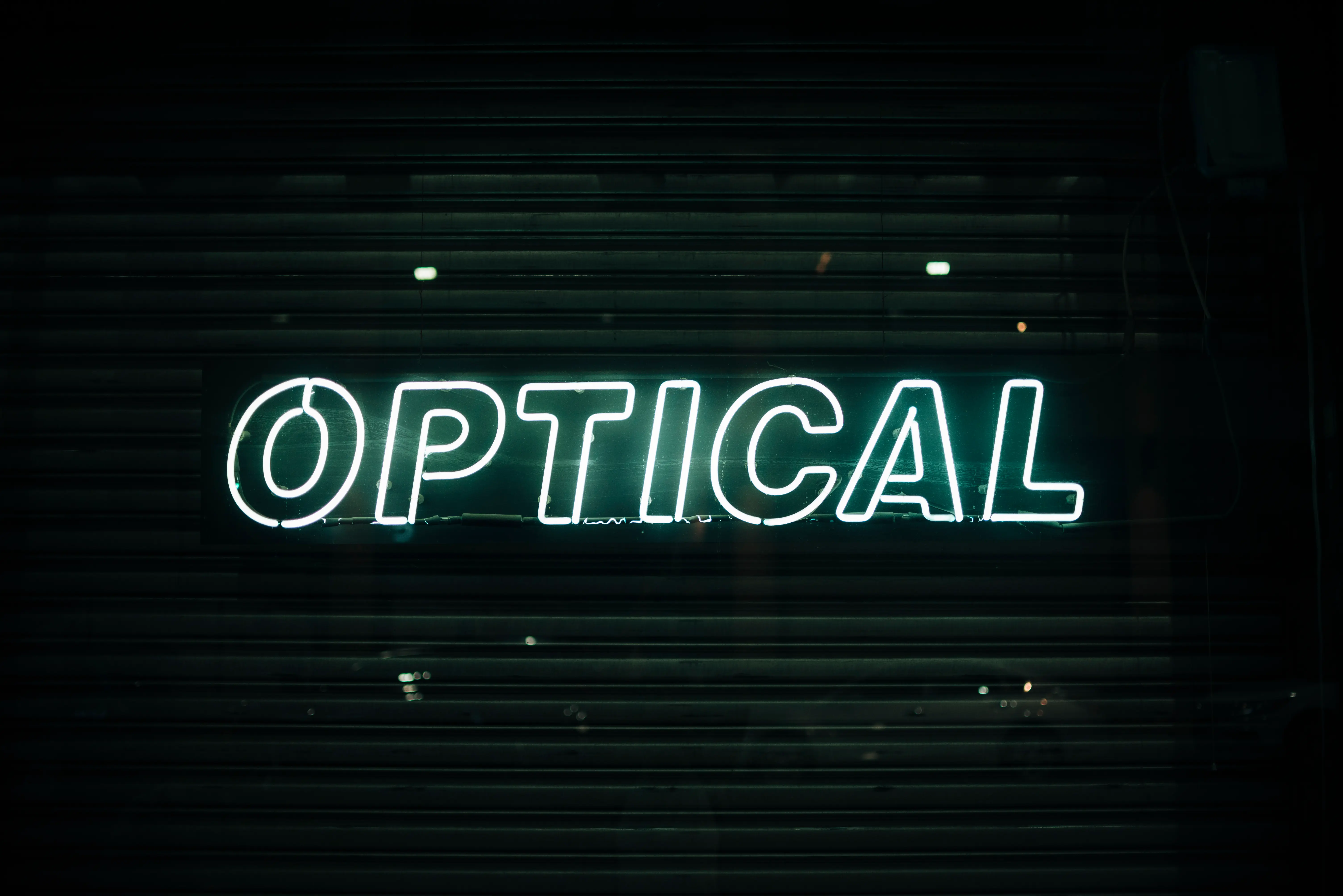 Optical store neon sign in pink and white tubing