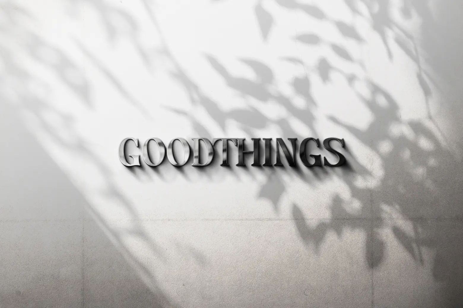 'Good Things' metal letter sign on a brick wall