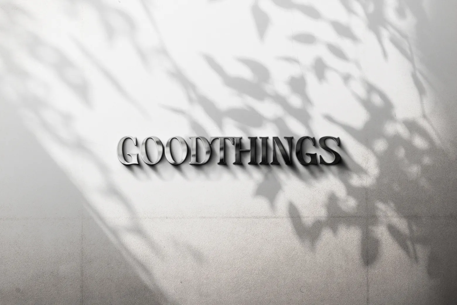 'Good Things' metal letter sign on a brick wall