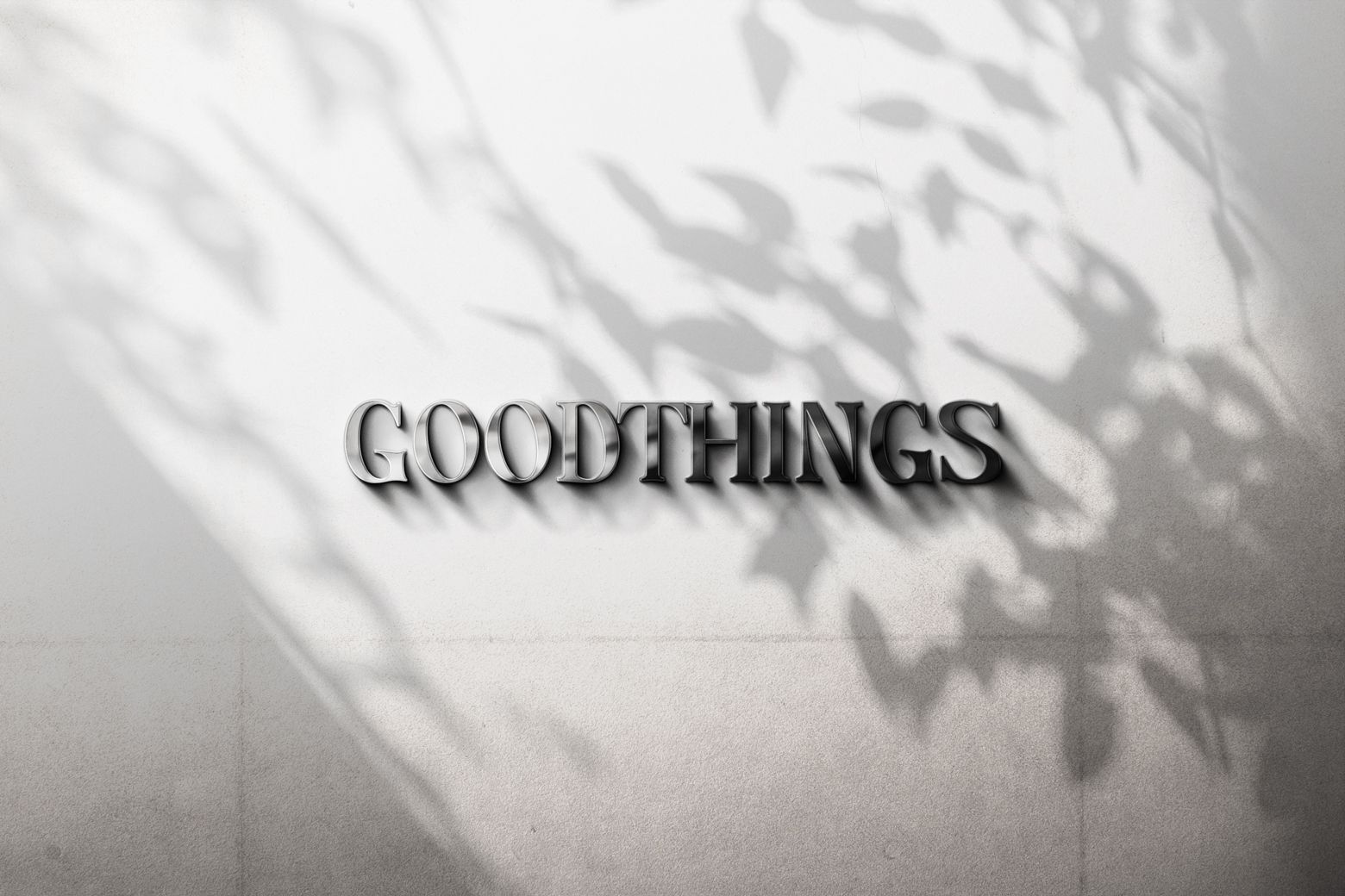'Good Things' metal letter sign on a brick wall