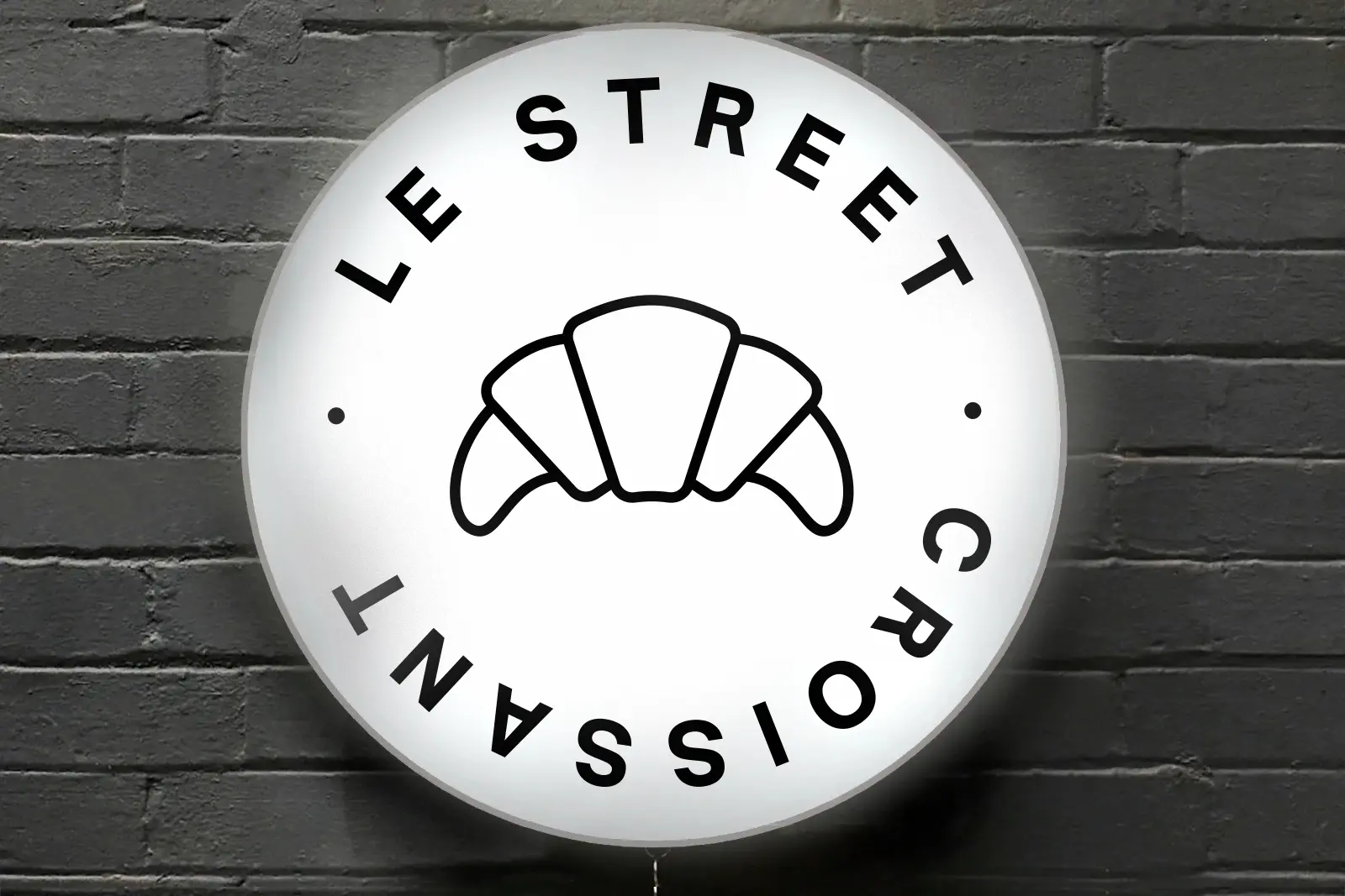 Le Street Croissant lightbox sign with custom face graphic