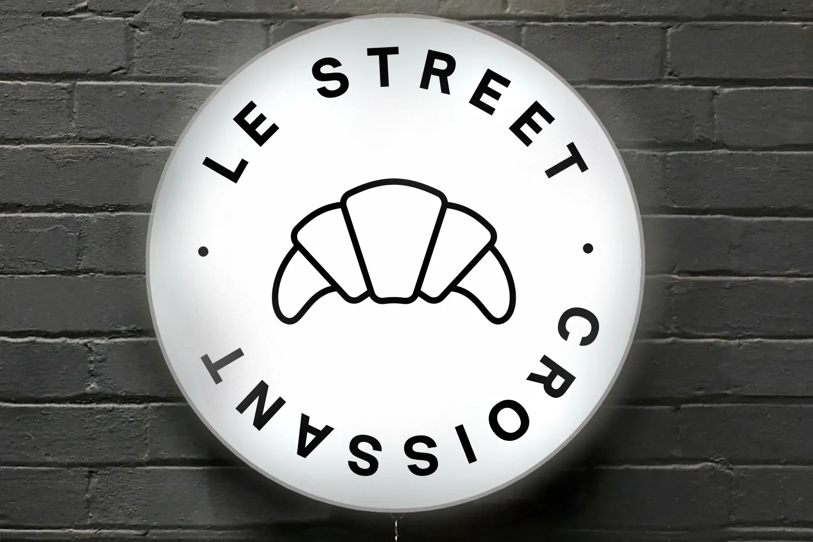 Le Street Croissant lightbox sign with custom face graphic