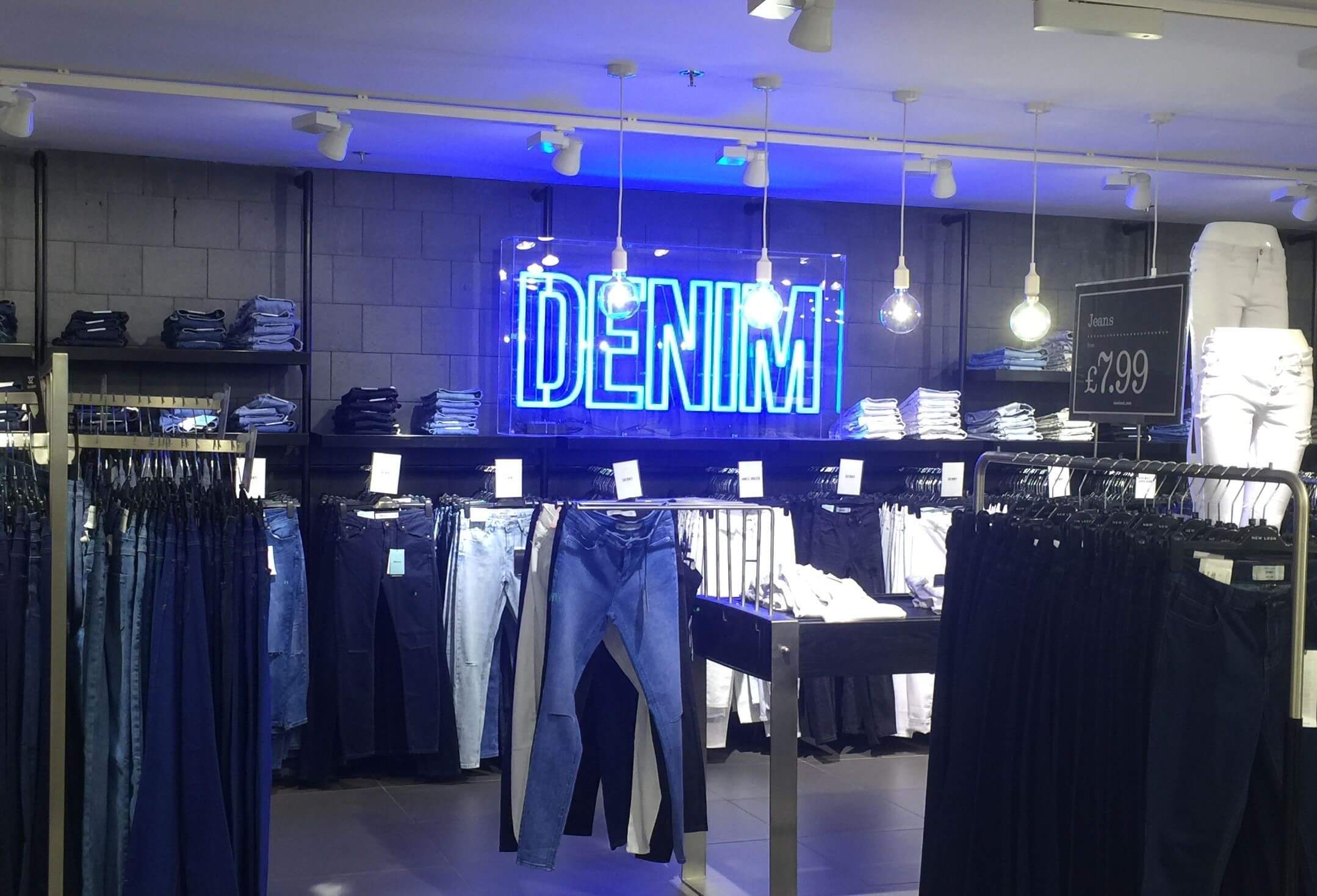 Electric blue neon signs at retail stores
