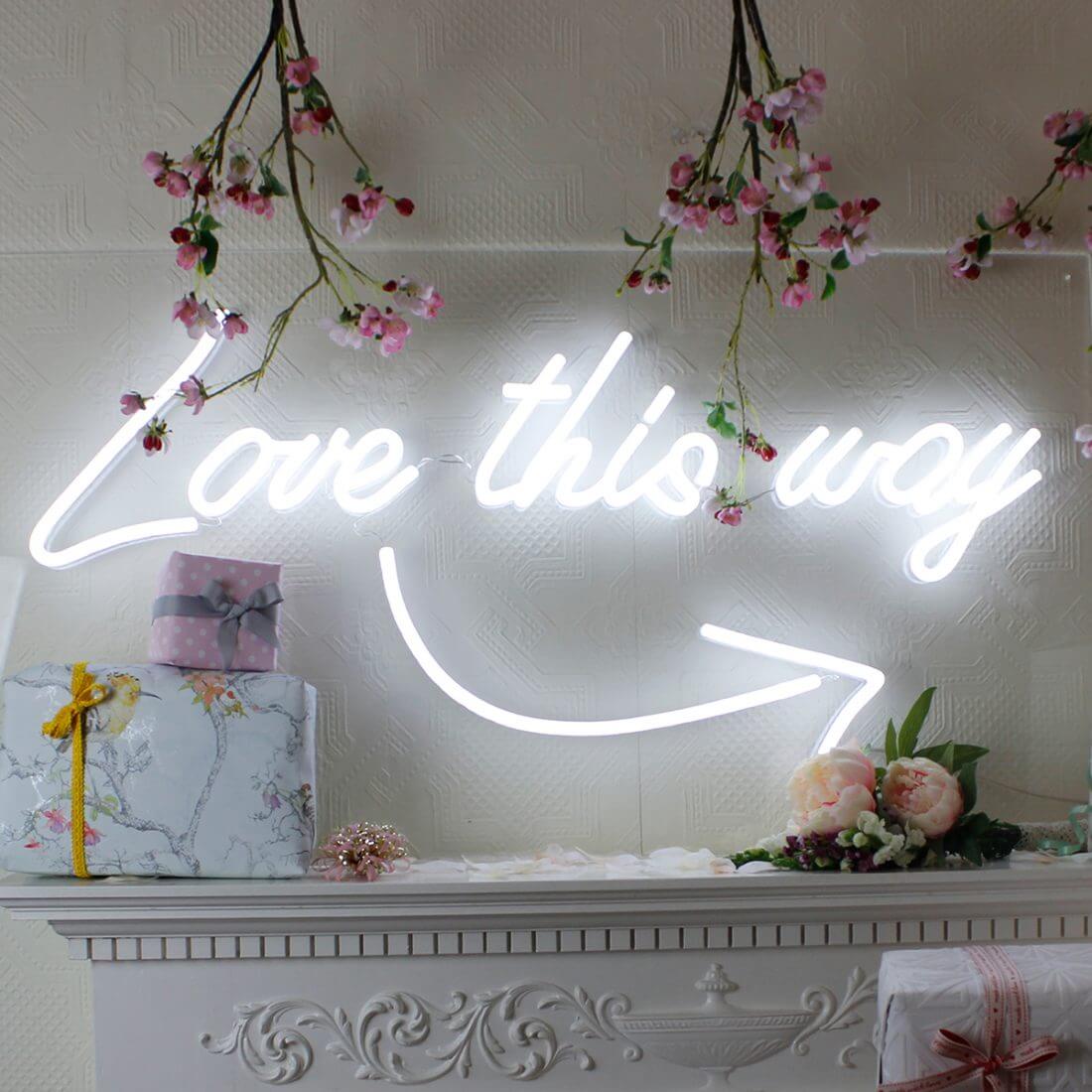 Use neon wedding signs for directional signs