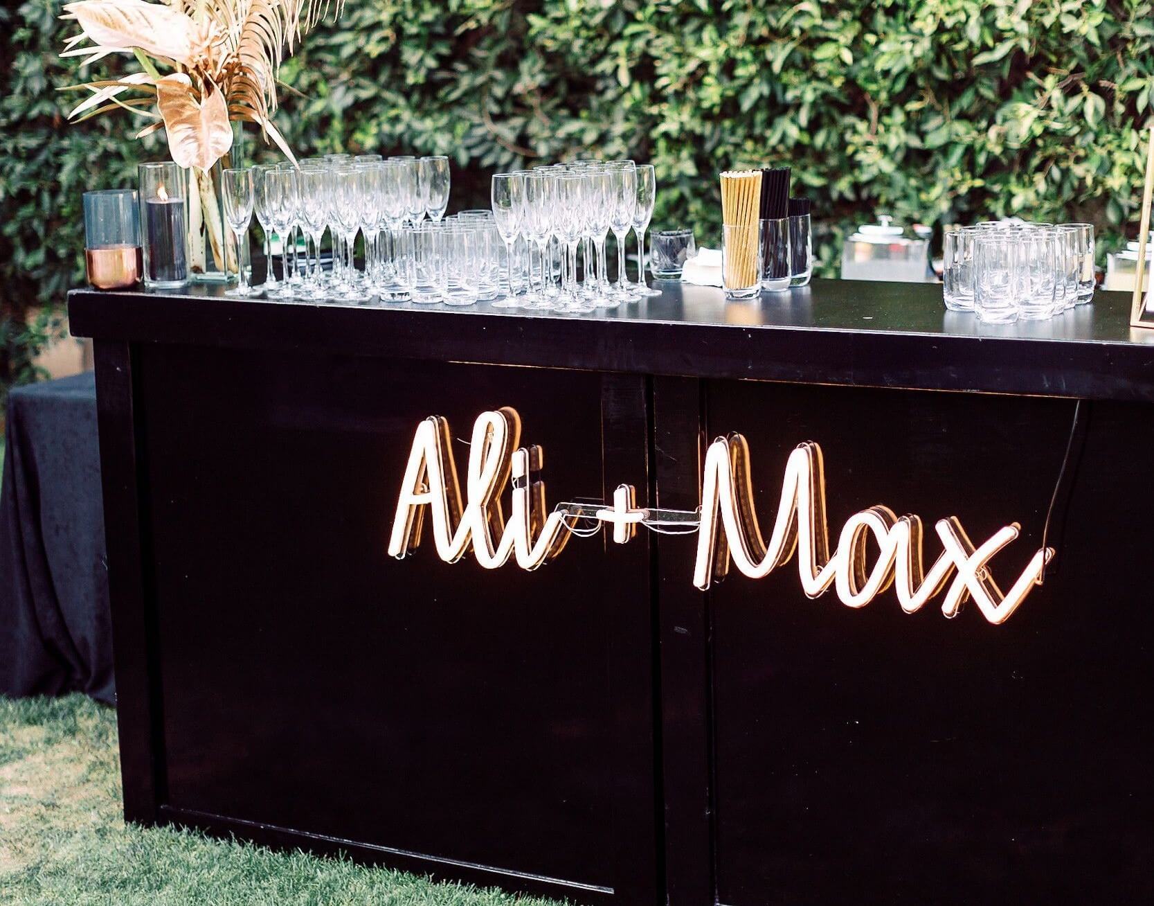 Use neon wedding signs for bar area